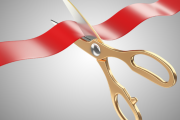 scissors cutting through tape